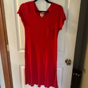 Red dress.  Scalloped sleeves and bottom.  Pocket on front.